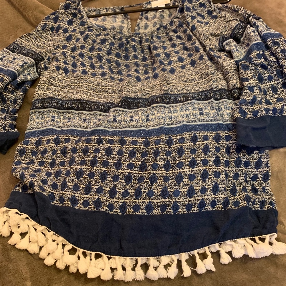 Blue colored top with tassel bottom accents